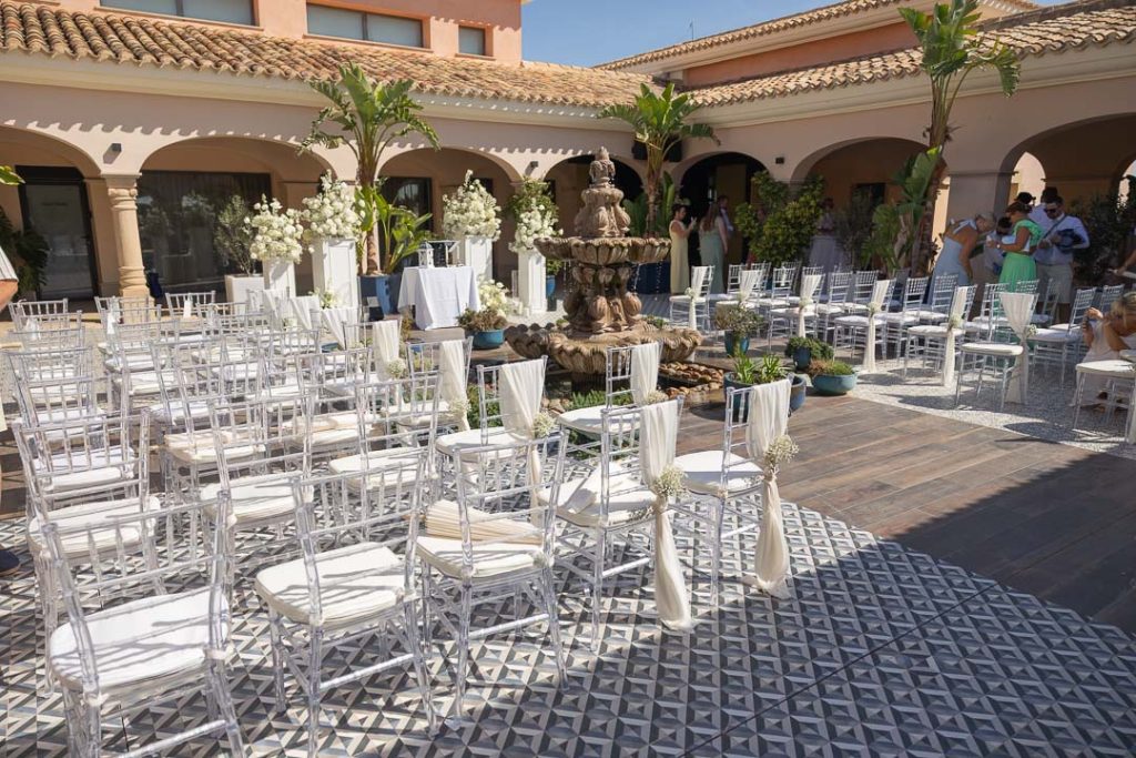 Intimate wedding setup in the inner plaza with arches
